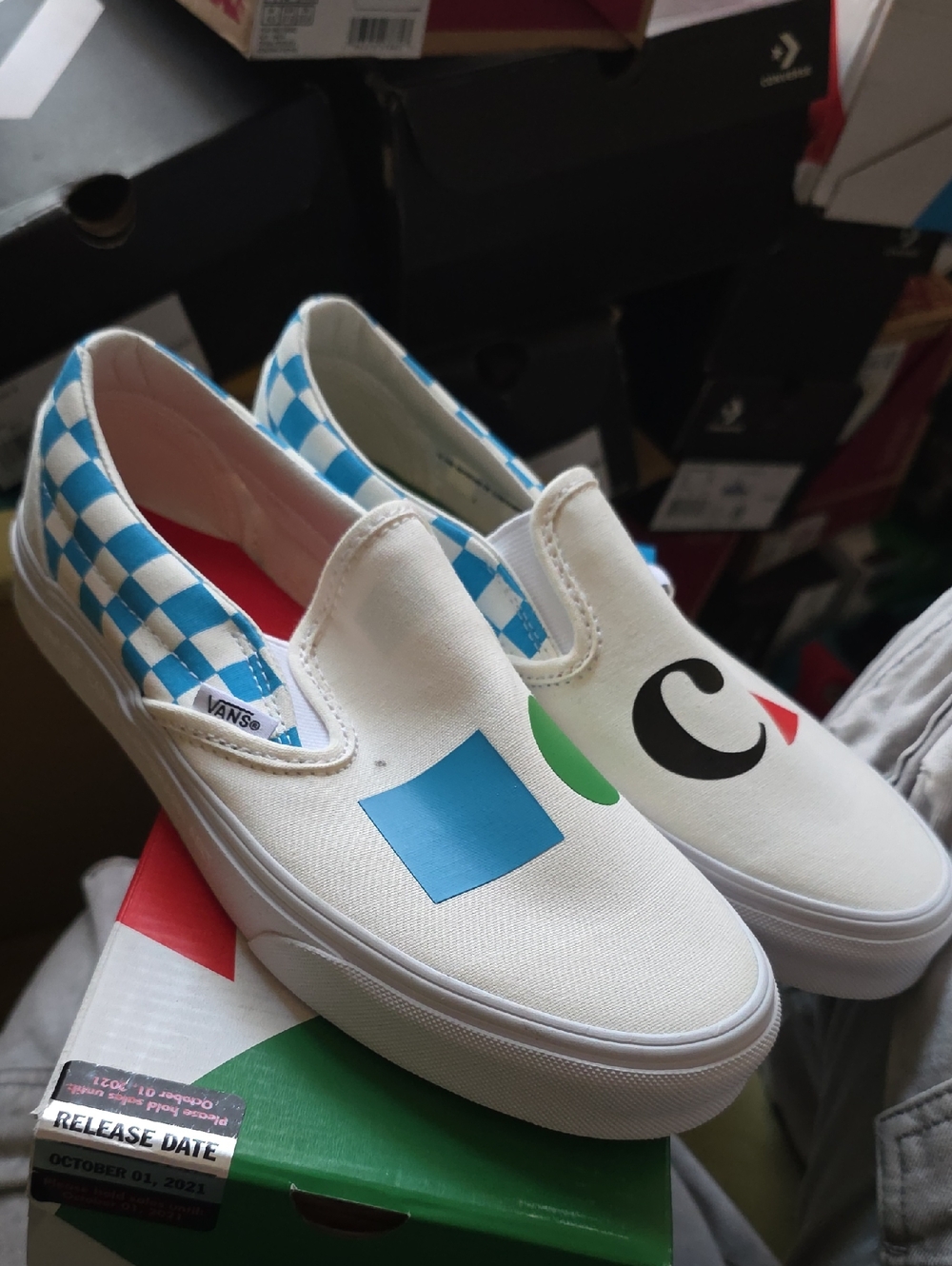Vans White Canvas Slip-On Sneakers with Blue Checker & Multicolor Shapes